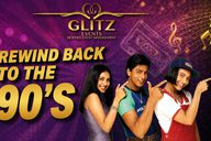 three singers from left to right: a lady in purple, man in blue and lady in cap and red top all point upwards while smiling. 'Rewind Back to the 90s' is displayed on the left in gold writing, on a purple background