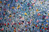 an abstract art piece of multicoloured wildflowers on a blue and white background