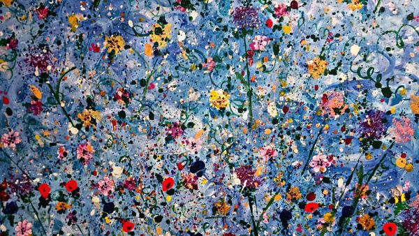 an abstract art piece of multicoloured wildflowers on a blue and white background