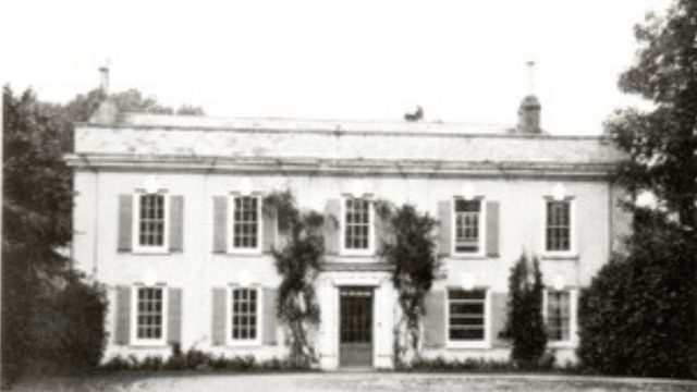 Image of a white Georgian building with sash windows 5 across.
