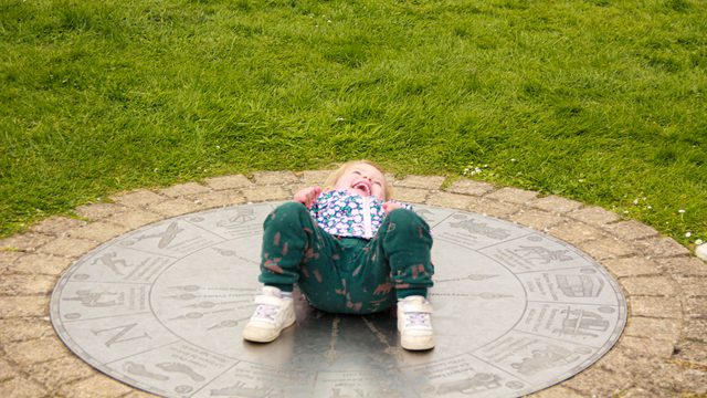 Laughing child on grass